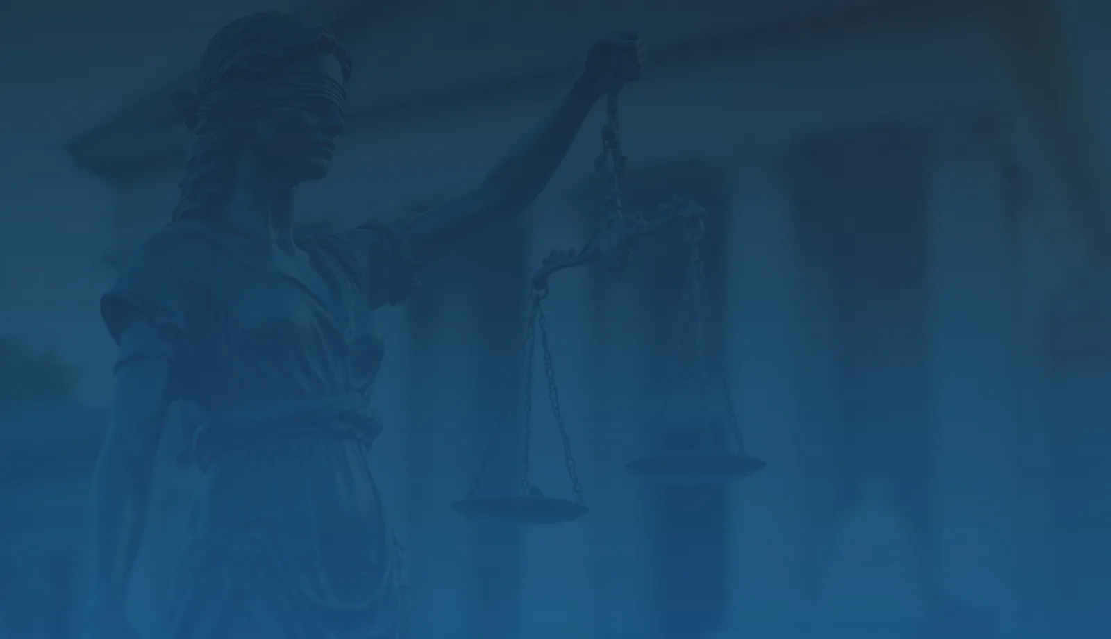 Statue of Lady Justice holding scales against a backdrop of a courthouse