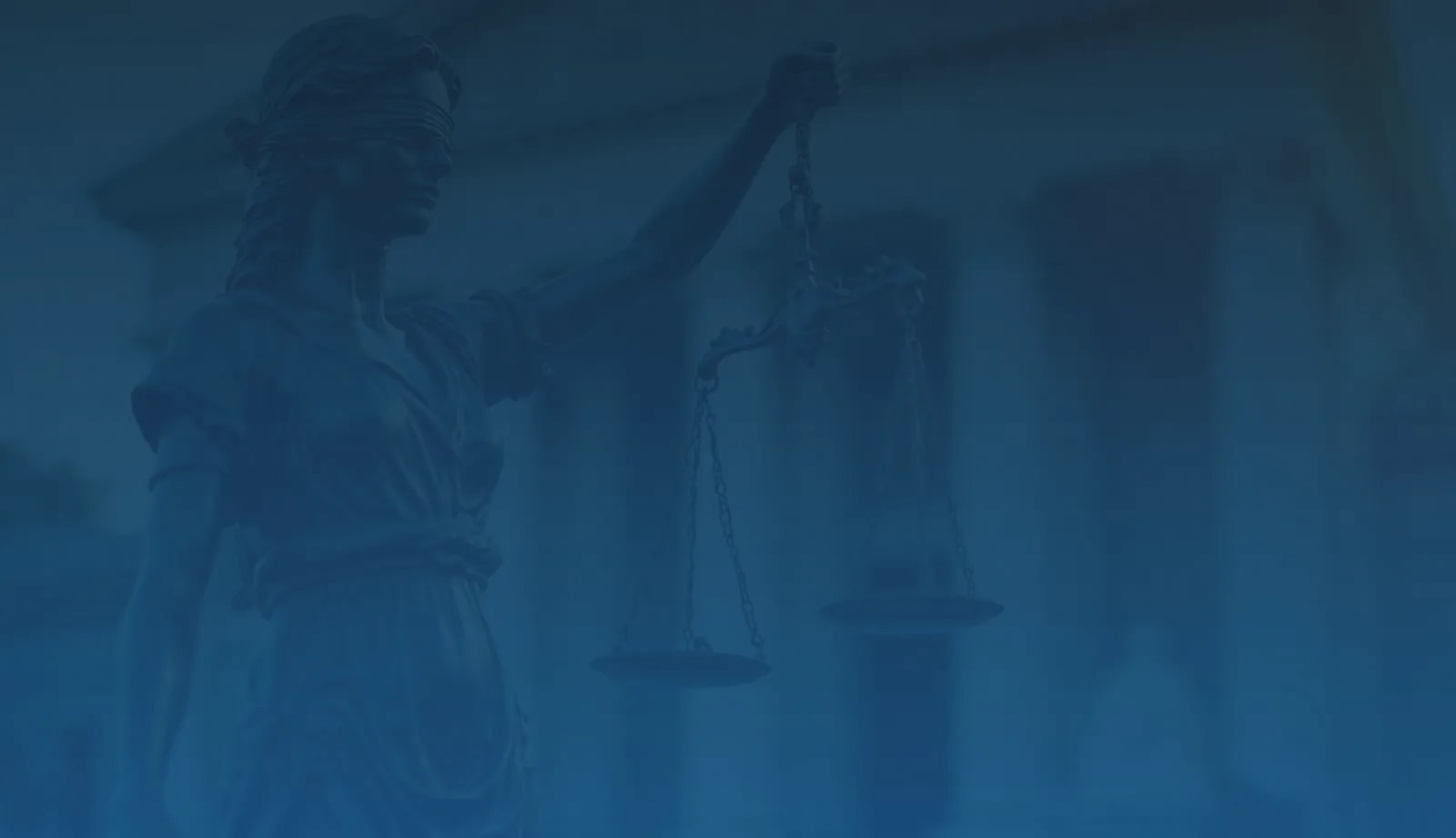 Statue of Lady Justice holding scales against a backdrop of a courthouse