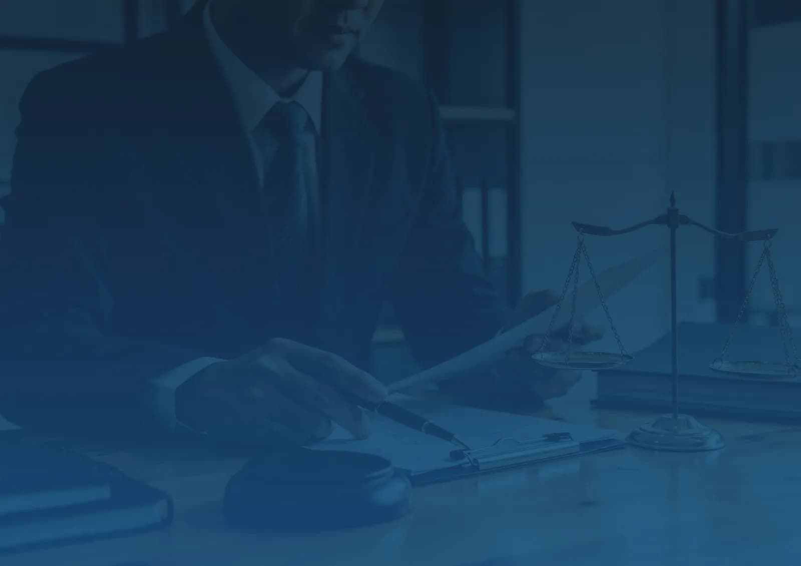A lawyer analyzing documents with a scale of justice.