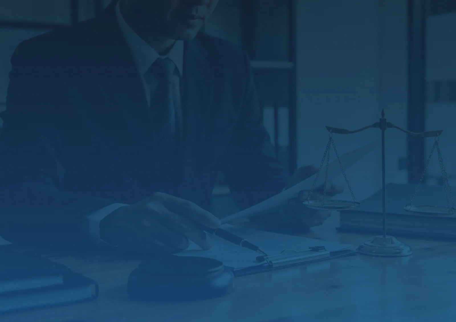A lawyer analyzing documents with a scale of justice.