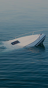 A sinking boat surrounded by water, showing signs of distress as it tilts and takes on water.