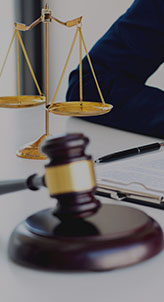 A close-up of a lawyer's desk with a gavel, representing the legal profession - Charles Injury Law